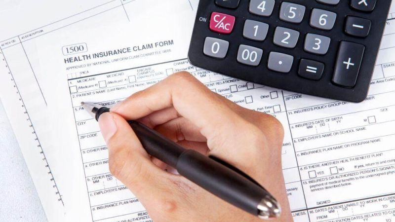 Person calculating health insurance coverage